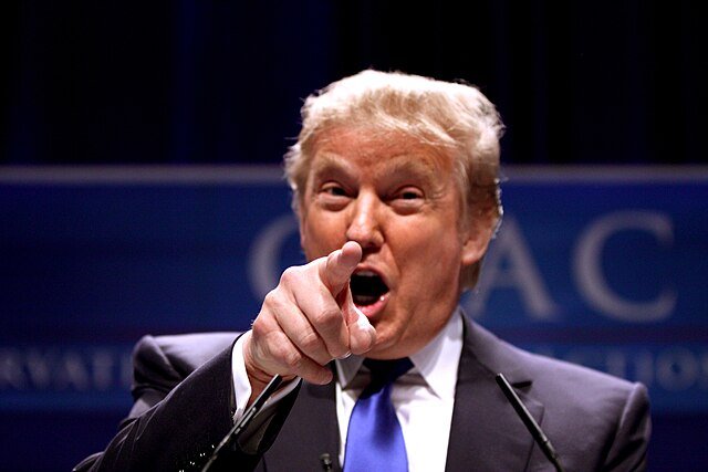Trump pointing and yelling towards the carmera.